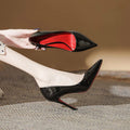 Red-soled high heels