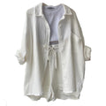 A two-piece set of wrinkled fabric shirt and high-waisted shorts