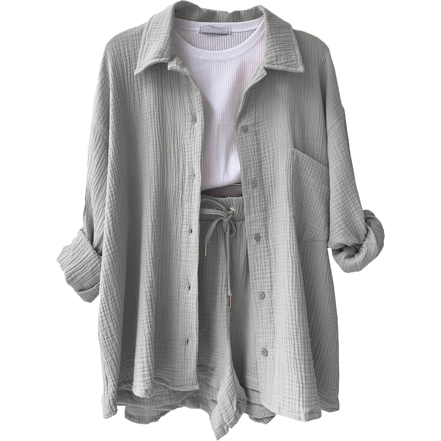 A two-piece set of wrinkled fabric shirt and high-waisted shorts