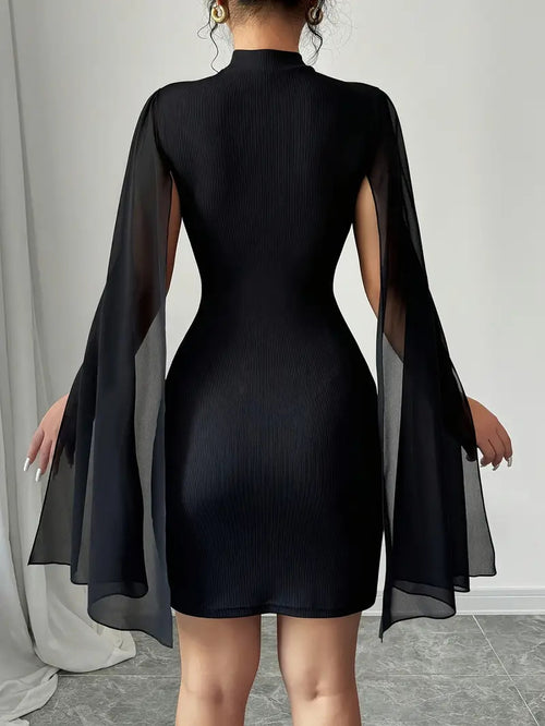 Poncho-style wrap dress with a flared skirt.